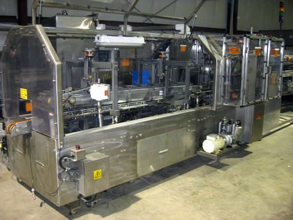 count plastic tray supplied to infeed system 
in a single lane w/narrow edge leading at 
random,