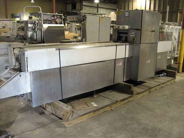 . 300 mm between chains, set up with 4 up 3-7/8” W X 5’ L die, Busch 250 vacuum pump, 230 volts, 3