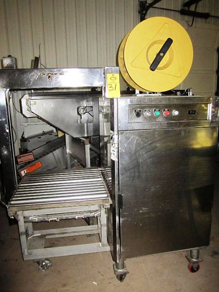 X 25" L X 27" H work area, uses 3/8" plastic strapping, on wheels for portabilty [Located in