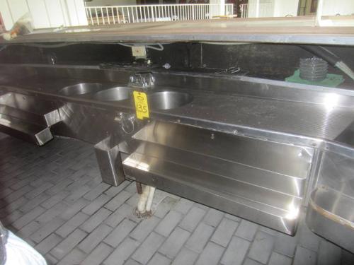 Formica top, brass foot rest, 3 compartment refrigerator 25 in W X 46 in L, s.s. sink, 24 in W X 12