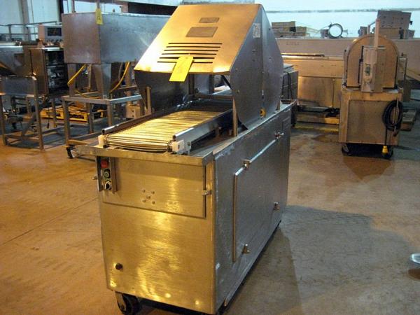 X 73IN L s.s. chain belt, on wheels, 220/460 volt, 5 h.p., missing main door, head, & drive parts,