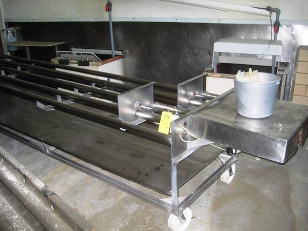 linders on Casters, (designed for round or square forms) s.s. tube frames, solid s.s. lower bed,