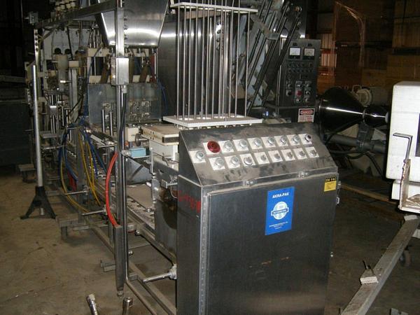 er, Akra Pak Mdl. DOS F 32 Variable Fill Machine, measures 15' L X 3' W X 8' H, 4 station piston