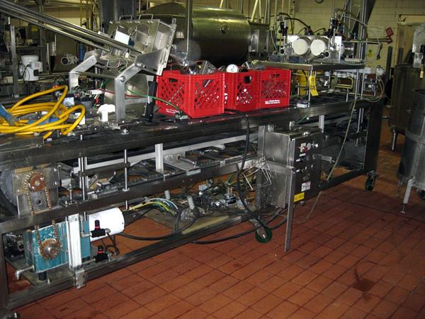 dual piston fillers & press on lidder, on s.s. frame, set up for 6" diam. round tray