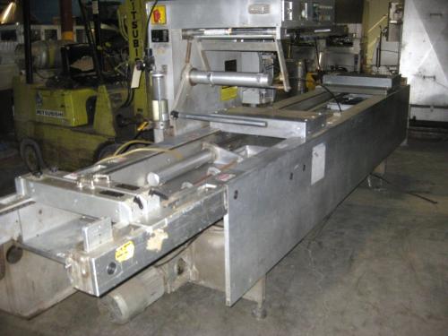 Packager, Ser. #511/25, set up w/2 up 8 1/2" X 11" die, mfg 1982, approx. 450 mm between chains,